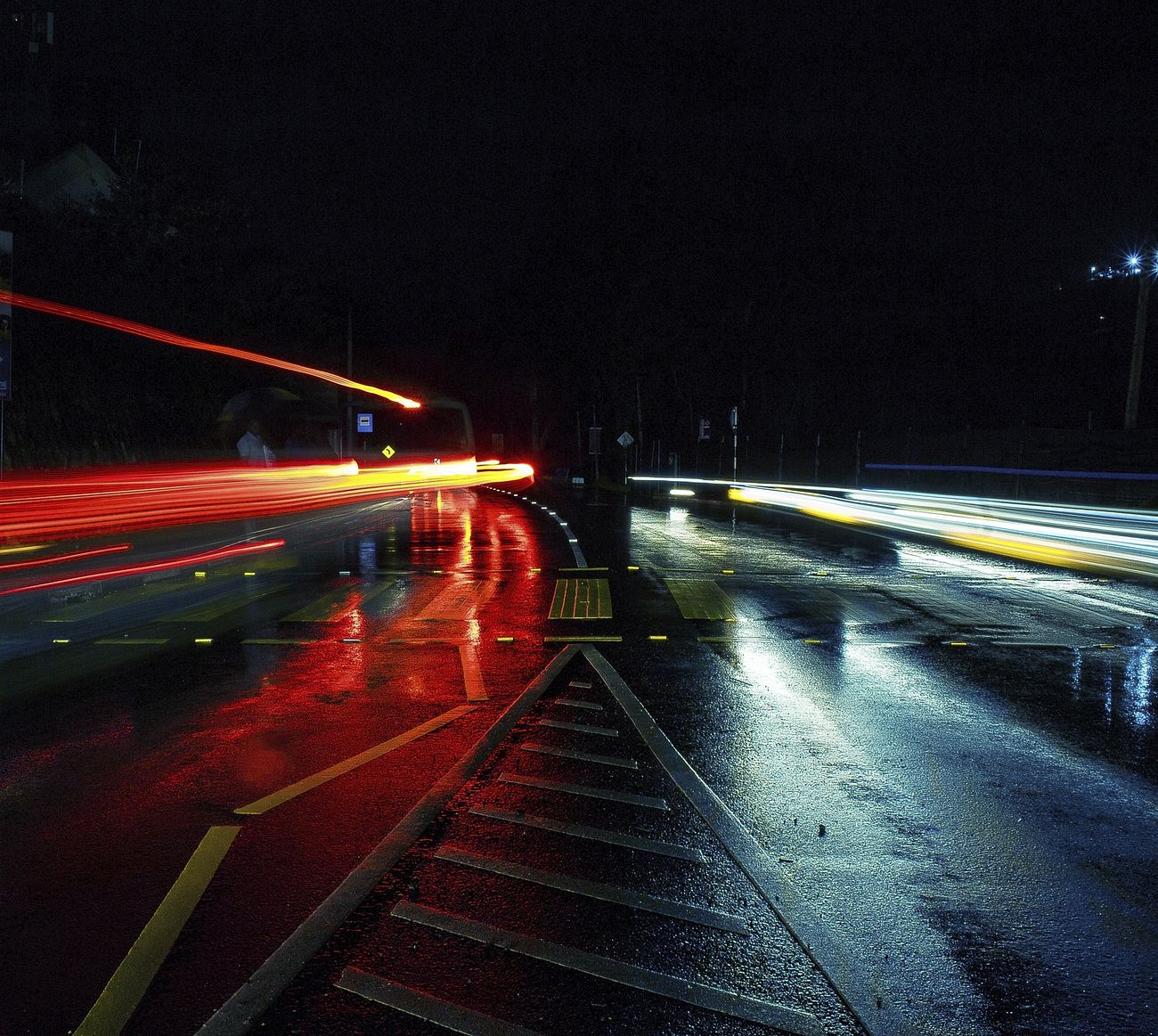 Multi-lane bridge at night with car