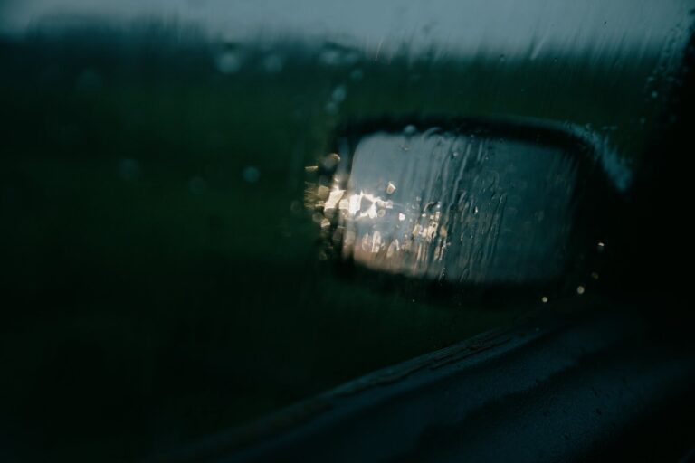 through window of car on mirror